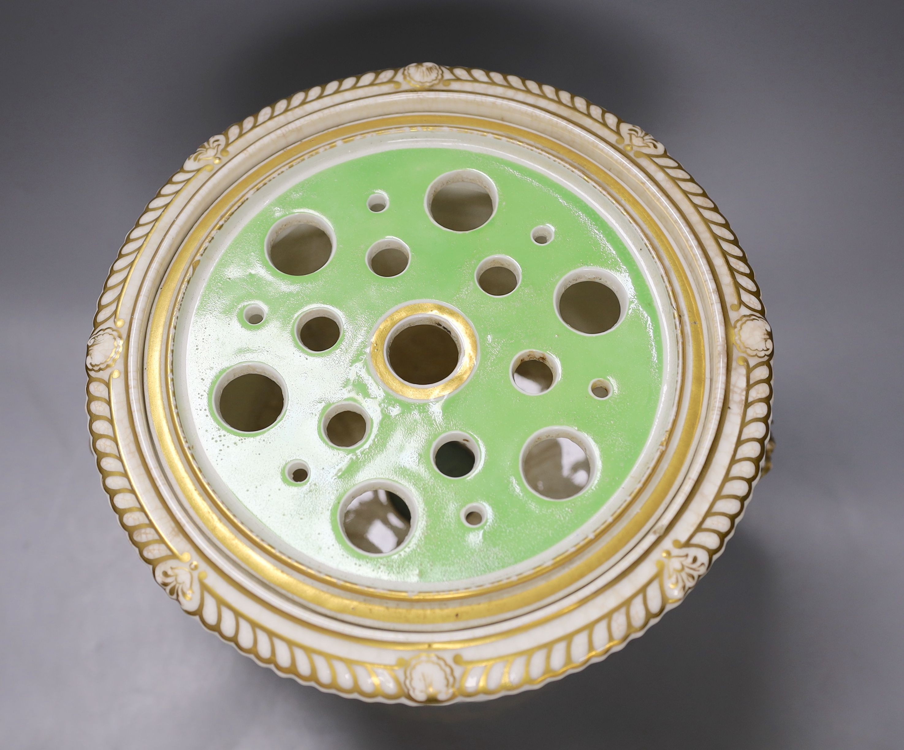An English porcelain campana shaped ice pail and two covers painted with flowers and a green ground, c.1830 (handles re-attached) 30cm